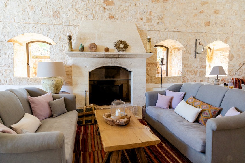 Masseria Petrarolo living room with fireplace and cozy seating
