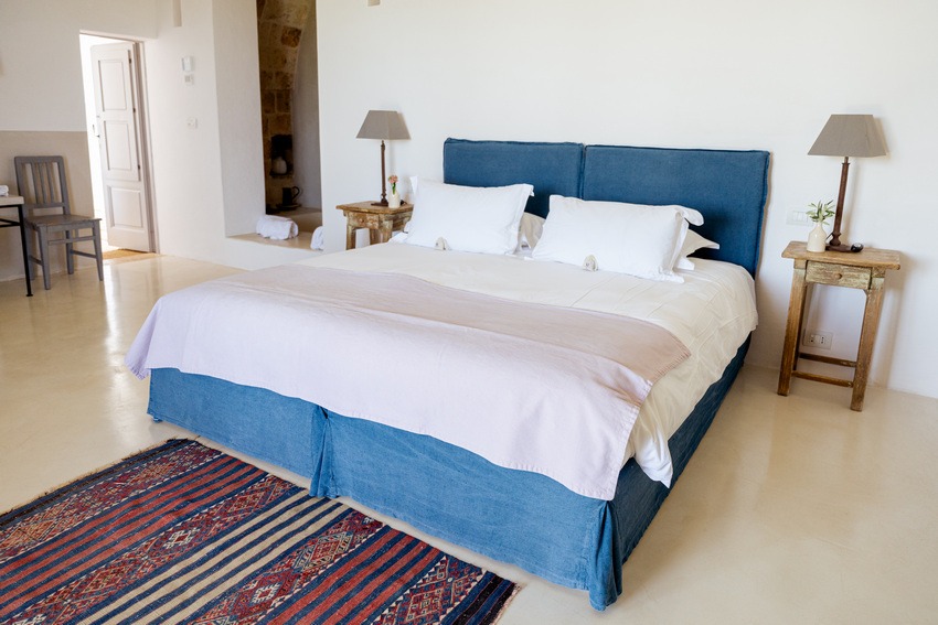 Masseria Petrarolo bedroom with simple layout and natural light