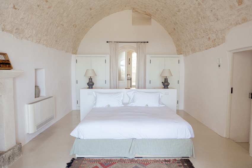 Masseria Petrarolo bedroom with soft furnishings and natural textures