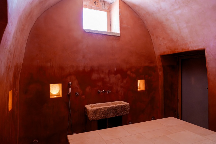 Masseria Petrarolo hammam with traditional arched design and warm tones