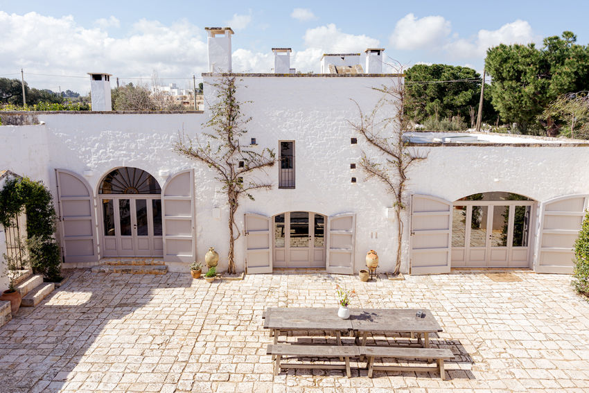 Masseria Petrarolo courtyard with seating area and stone details