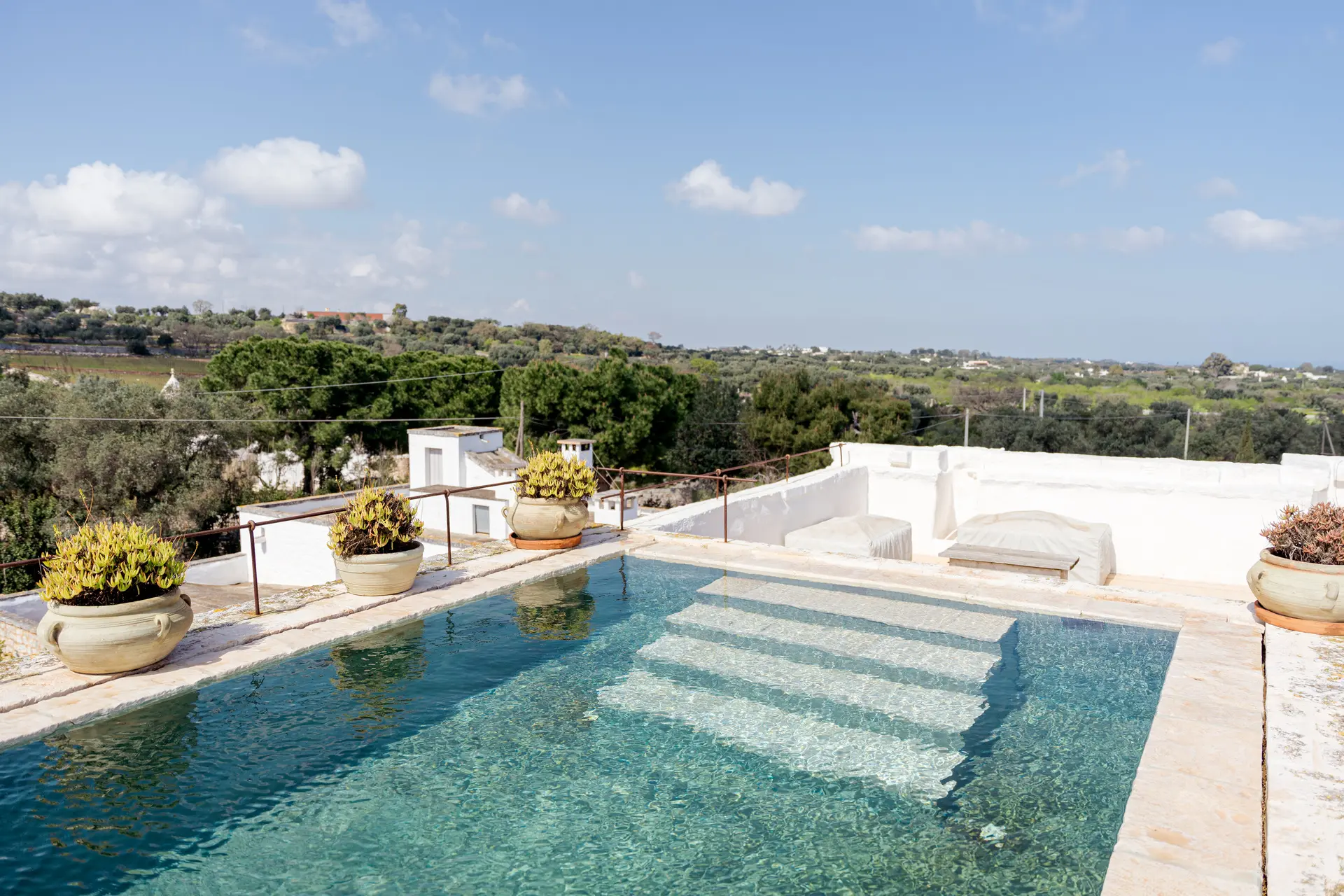 Masseria Petrarolo pool with steps and countryside view