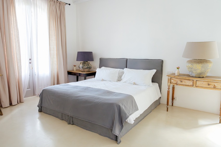 Masseria Petrarolo bedroom with window view and neutral decor