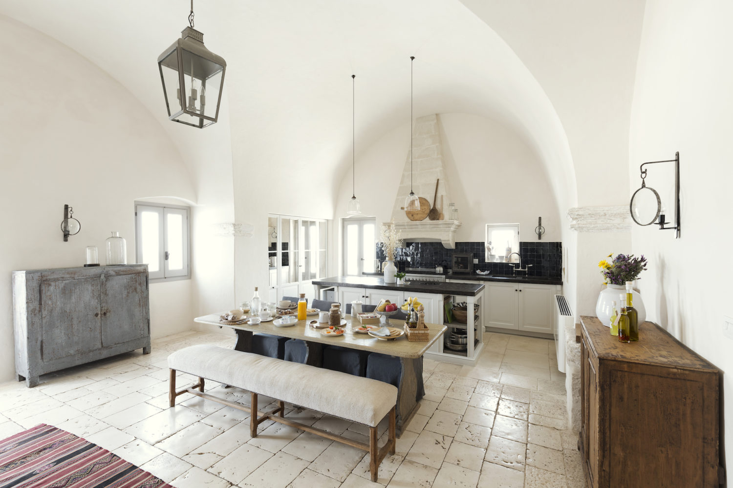 A table set in the vaulted kitchen dining room