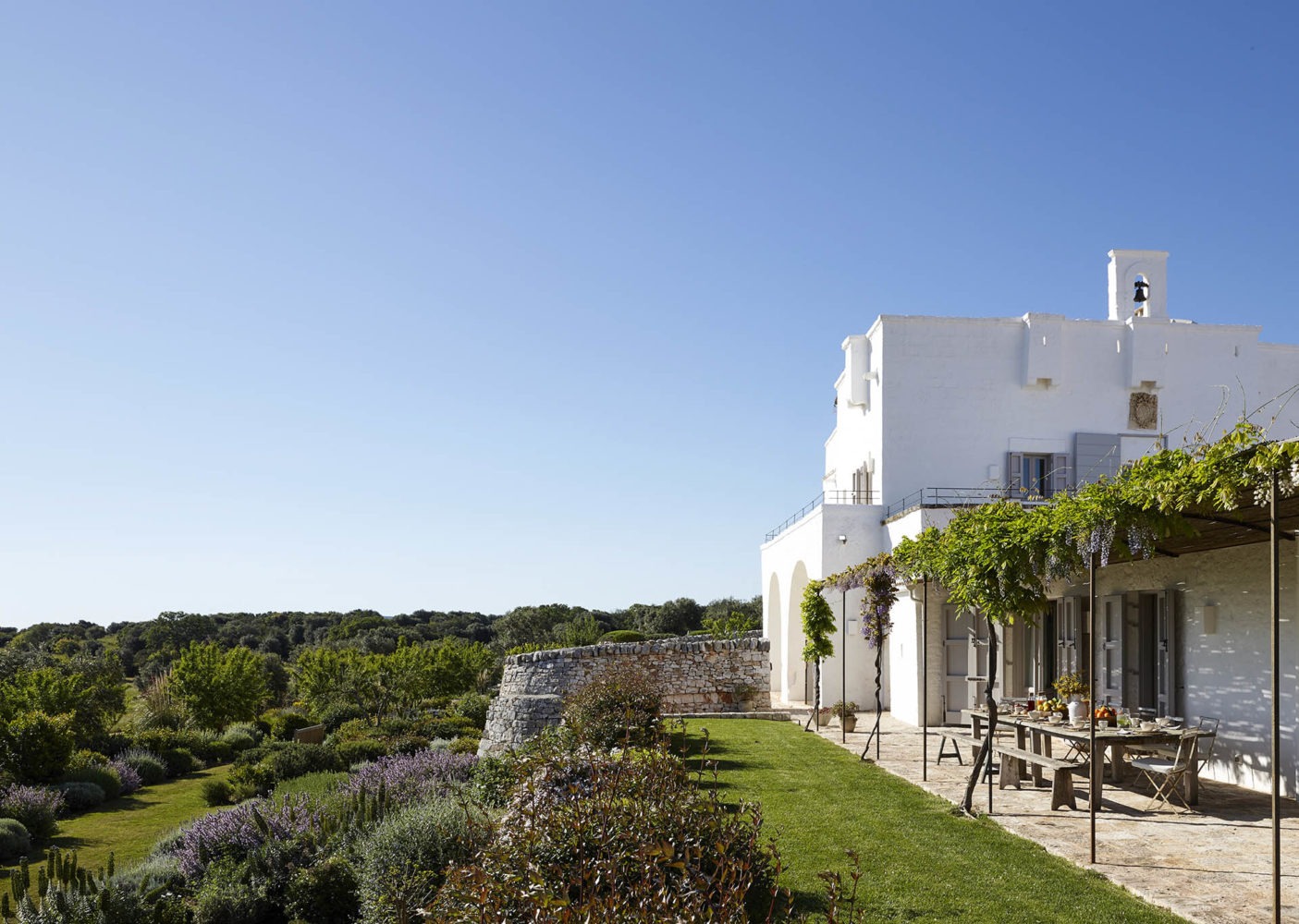 Breakfast on the vine-covered terrace overlooking the Mediterranean gardens