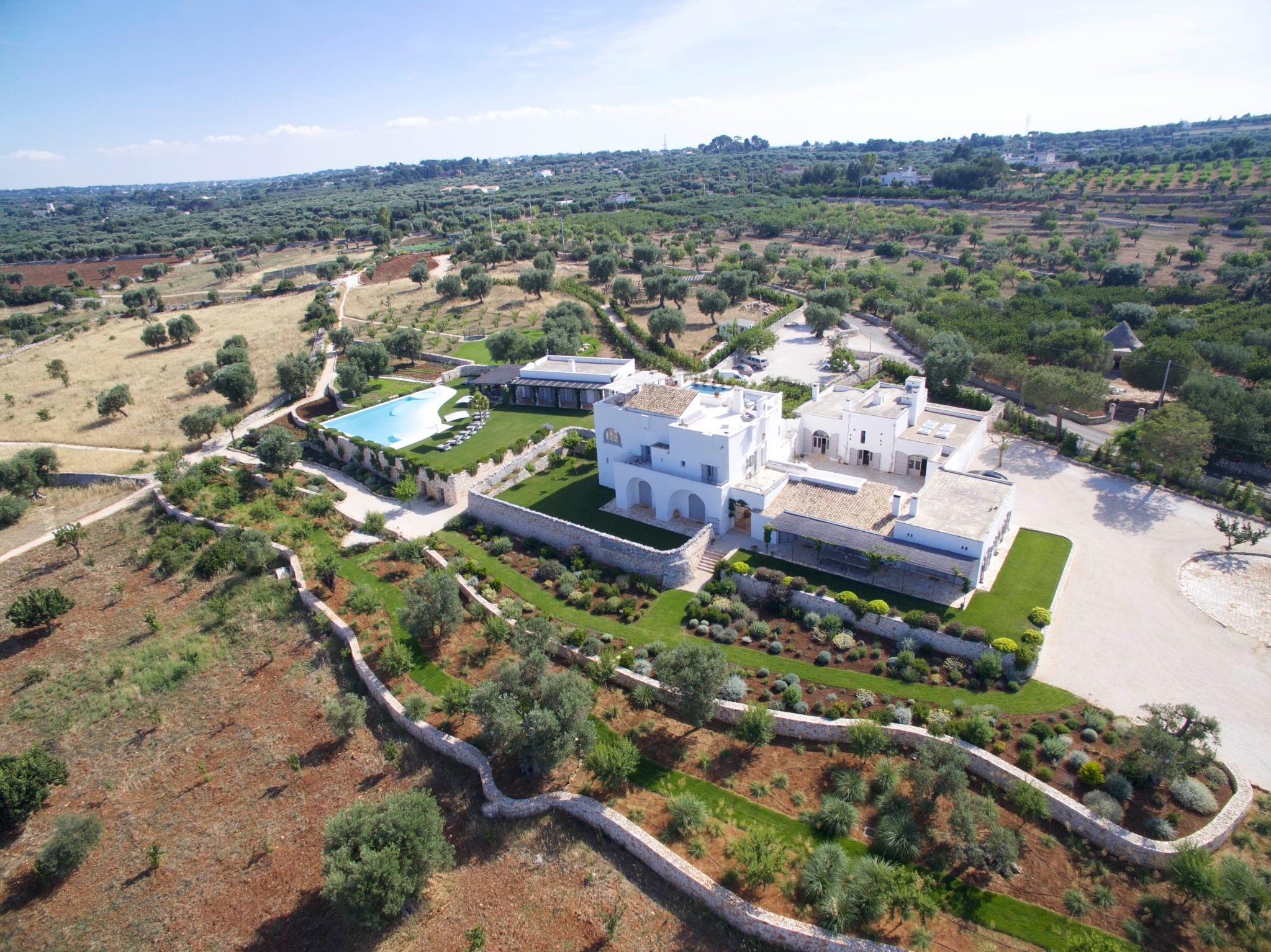 Masseria Petrarolo, its gardens and main pool from above
